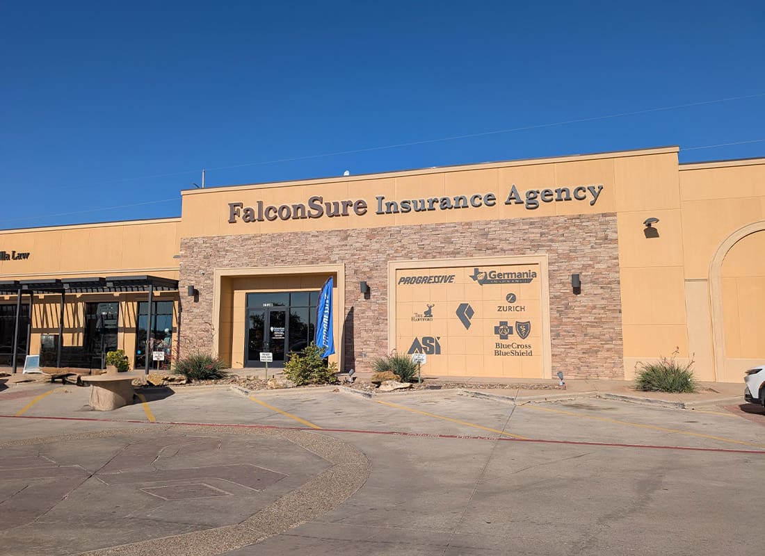 Laredo, TX - Sandy Building Up Against a Blue Sky Standing Tall and Mighty With Insurance Partners on the Building